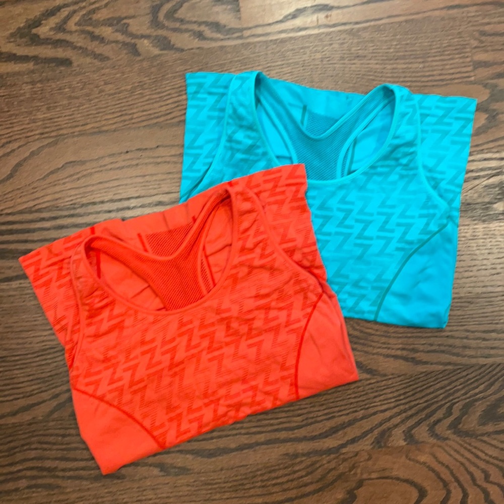 2 Zella racerback tanks with built in shelf bra in excellent condition